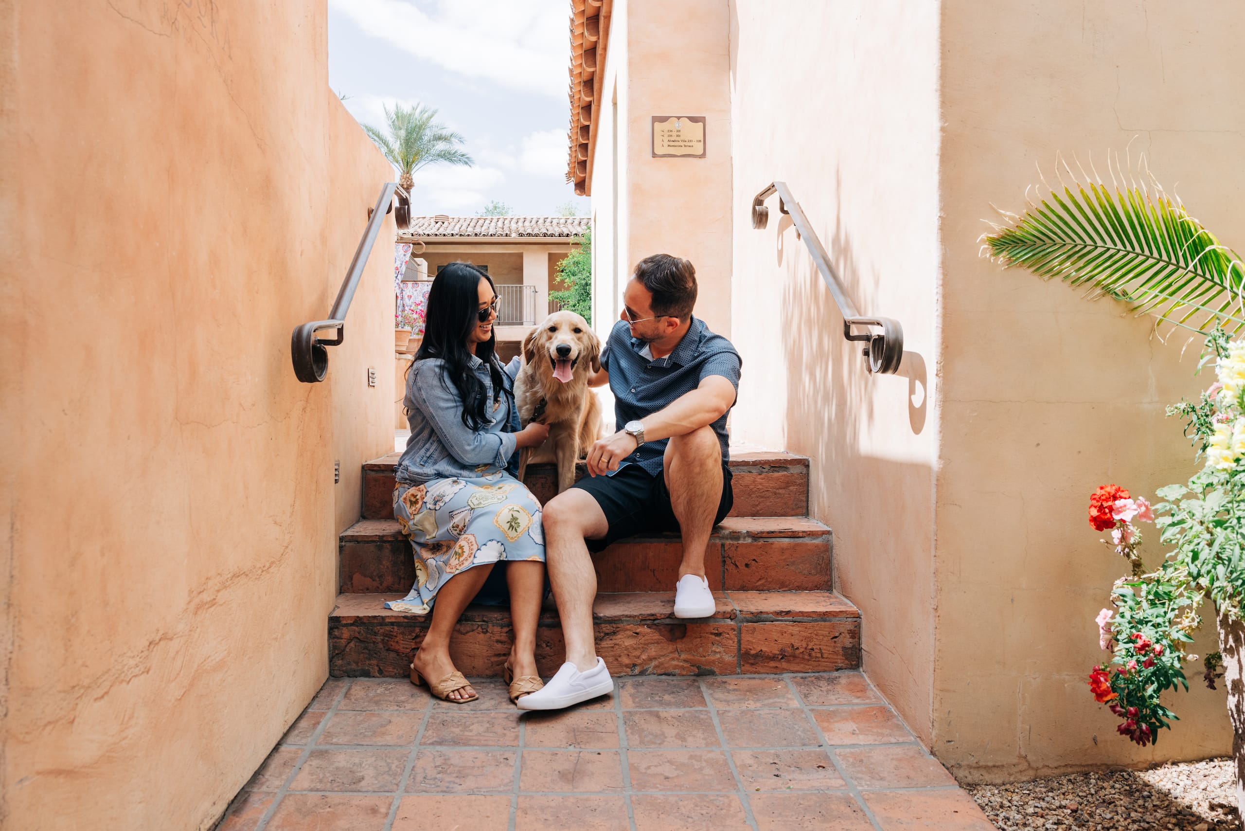 Royal Palms Resort and Spa Dog Photos With Couple On Courtyard Stairs