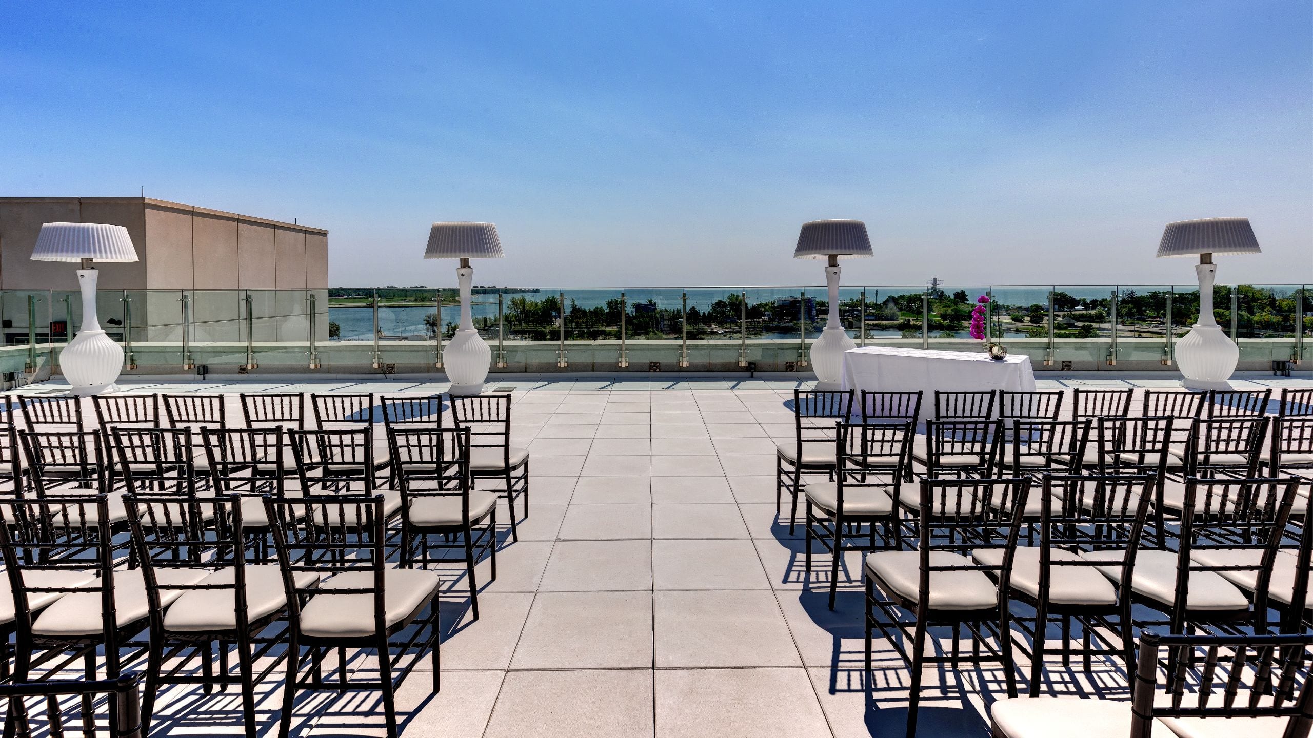 1 of 4 Hotel X Toronto High Park Terrace Event Seating and Lake Backdrop