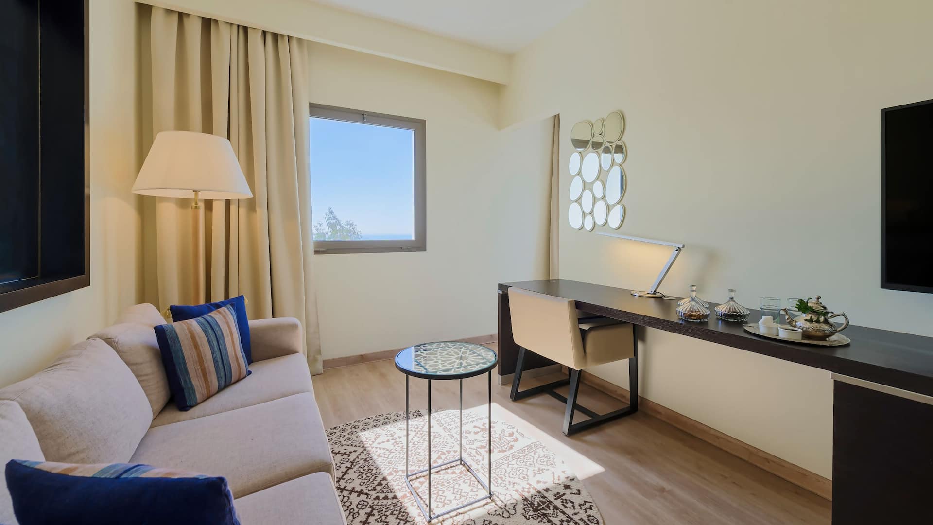 Hyatt Place Taghazout Bay Living Room With Sofa And Tv