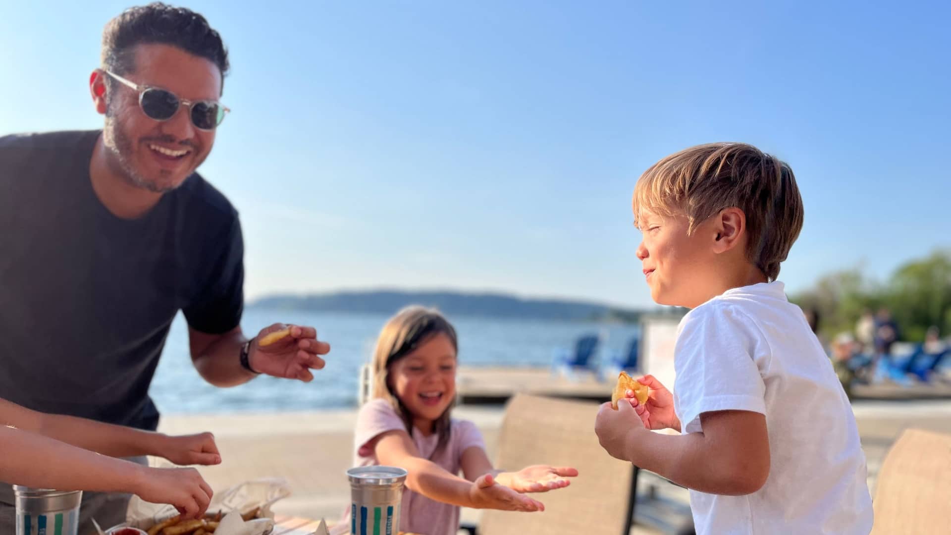 Hyatt Regency Lake Washington at Seattle's Southport Family Enjoying Dock And Drink
