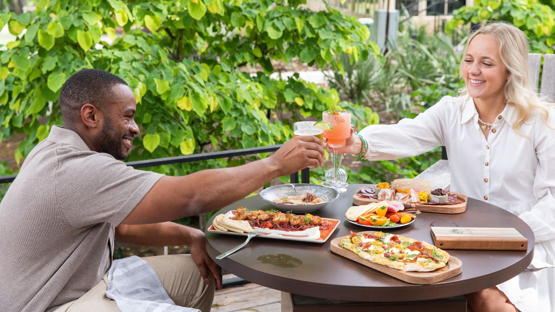 Hyatt Regency Lost Pines Resort and Spa Maudes Patio Couple Cheers