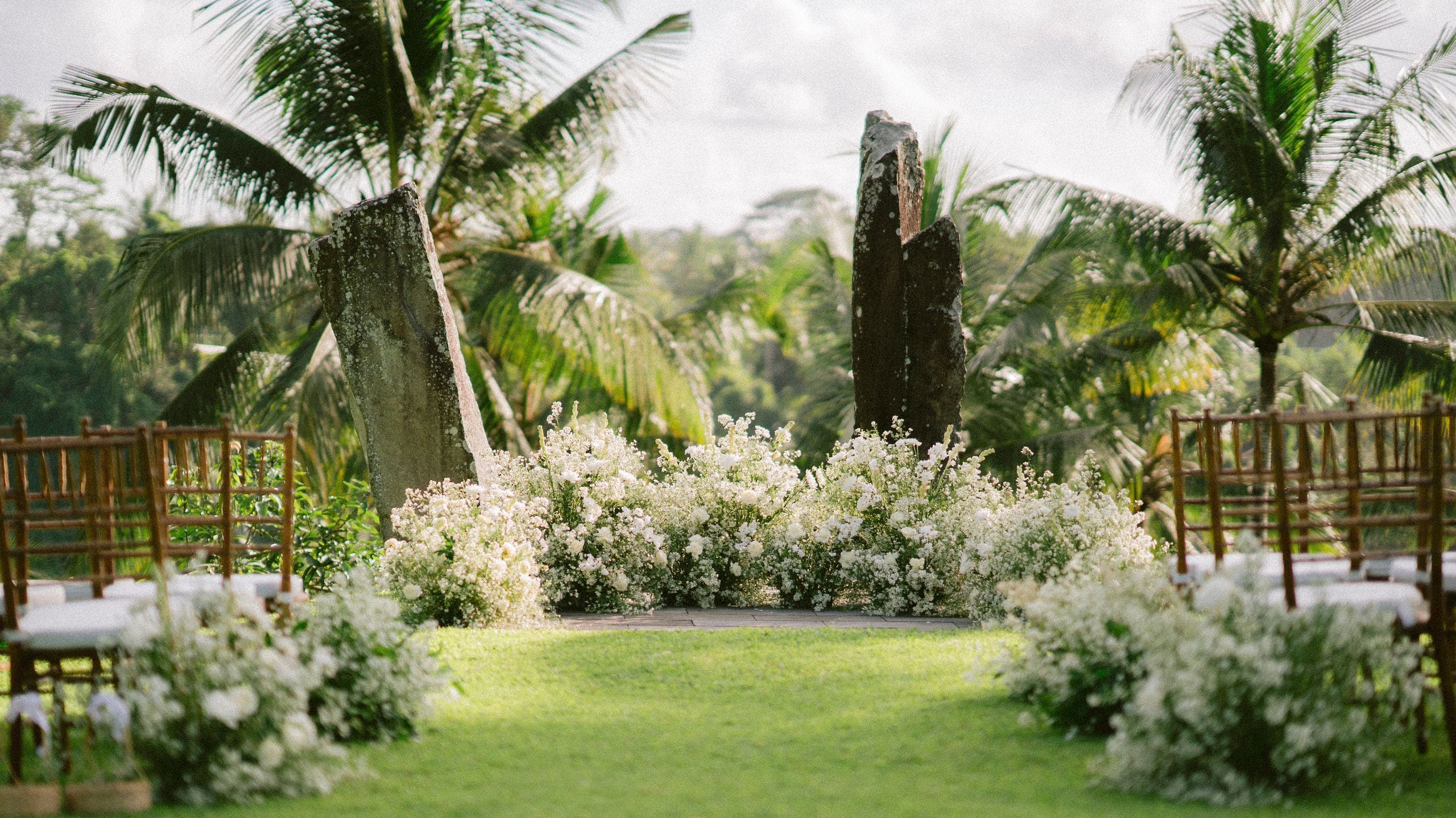 Alila Ubud Wedding Aisle Stone Flower Arrangements