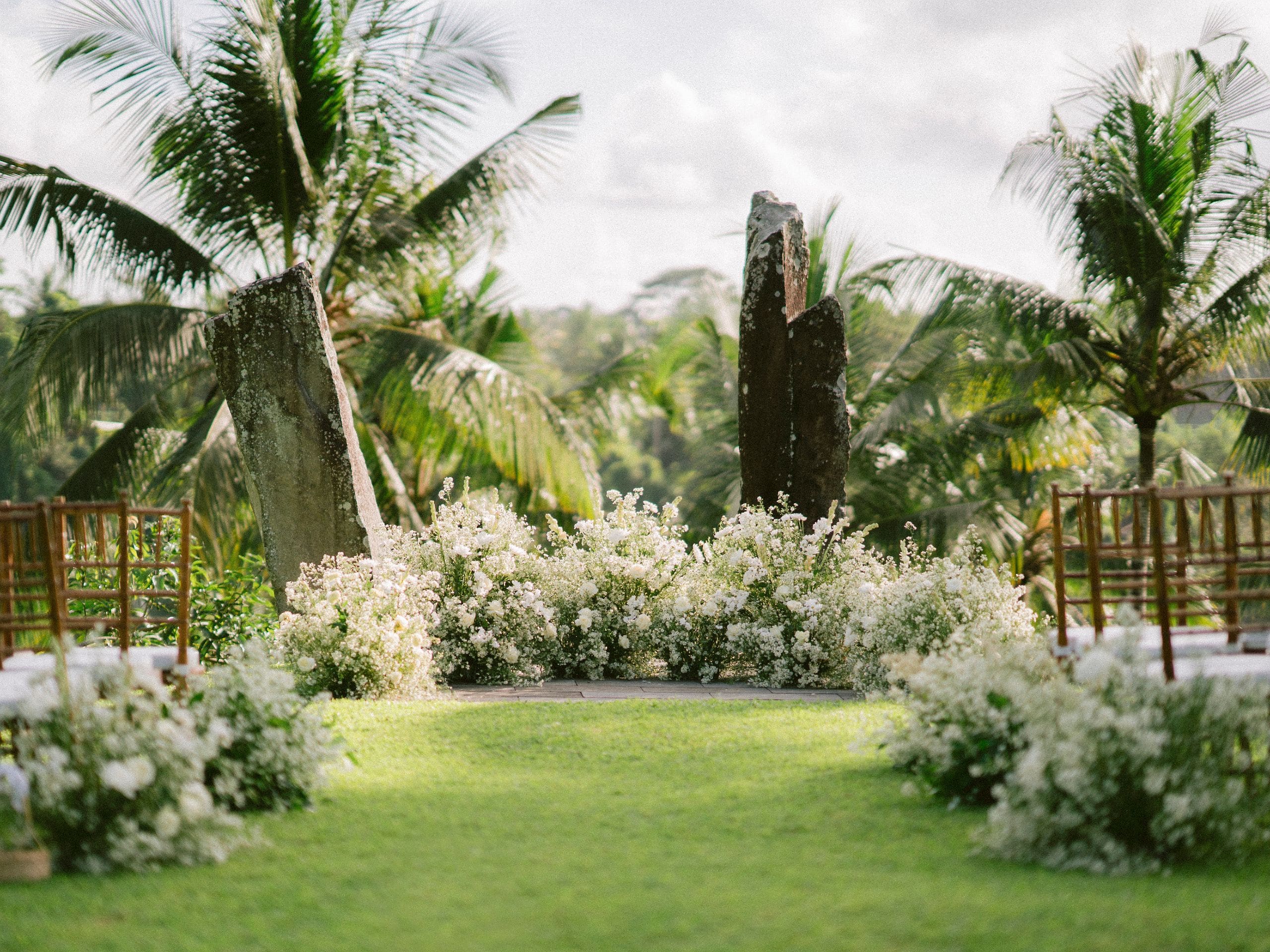 Alila Ubud Wedding Aisle Stone Flower Arrangements