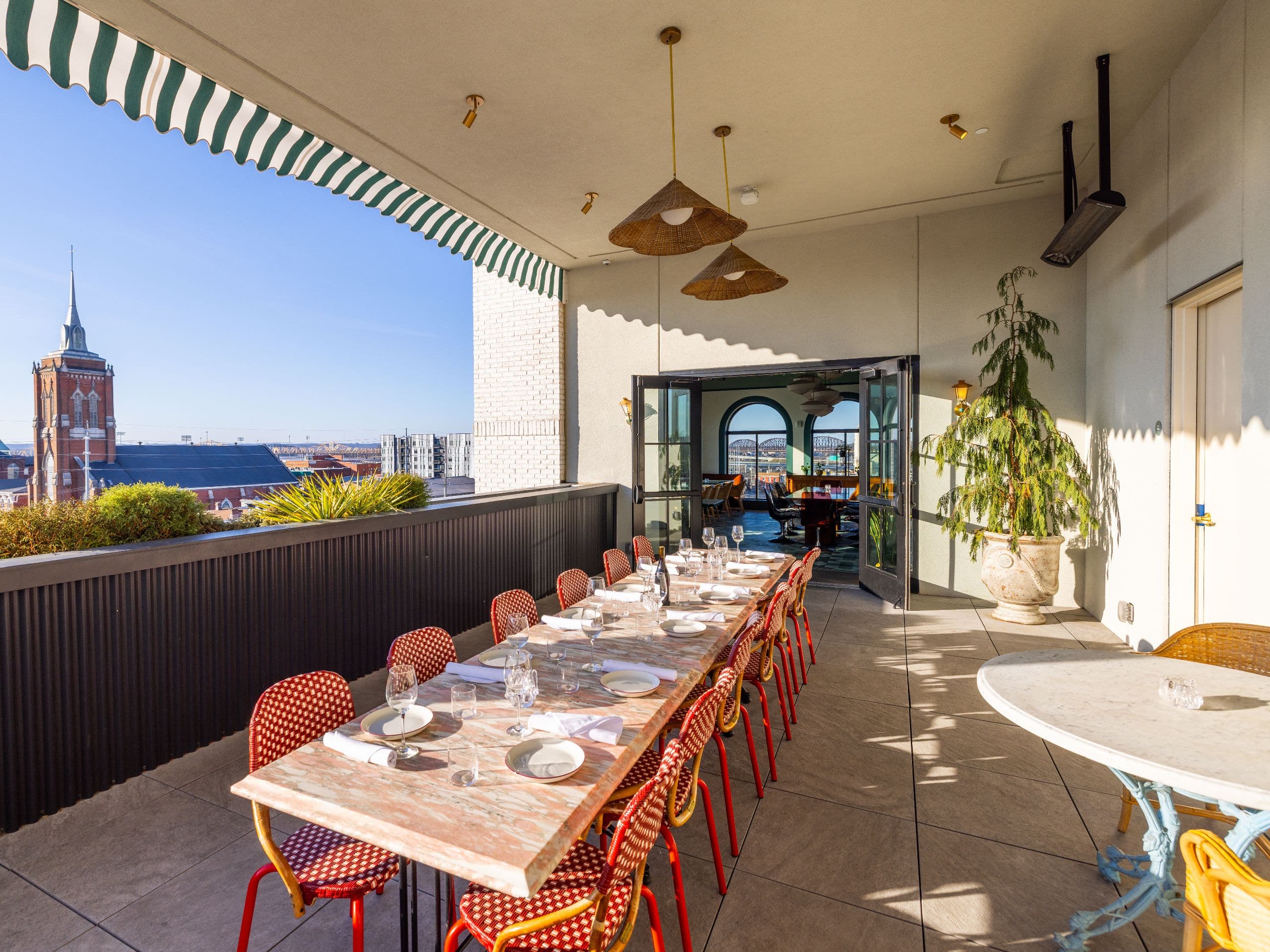 Hotel Genevieve Patio Event Set Up With Red Chairs