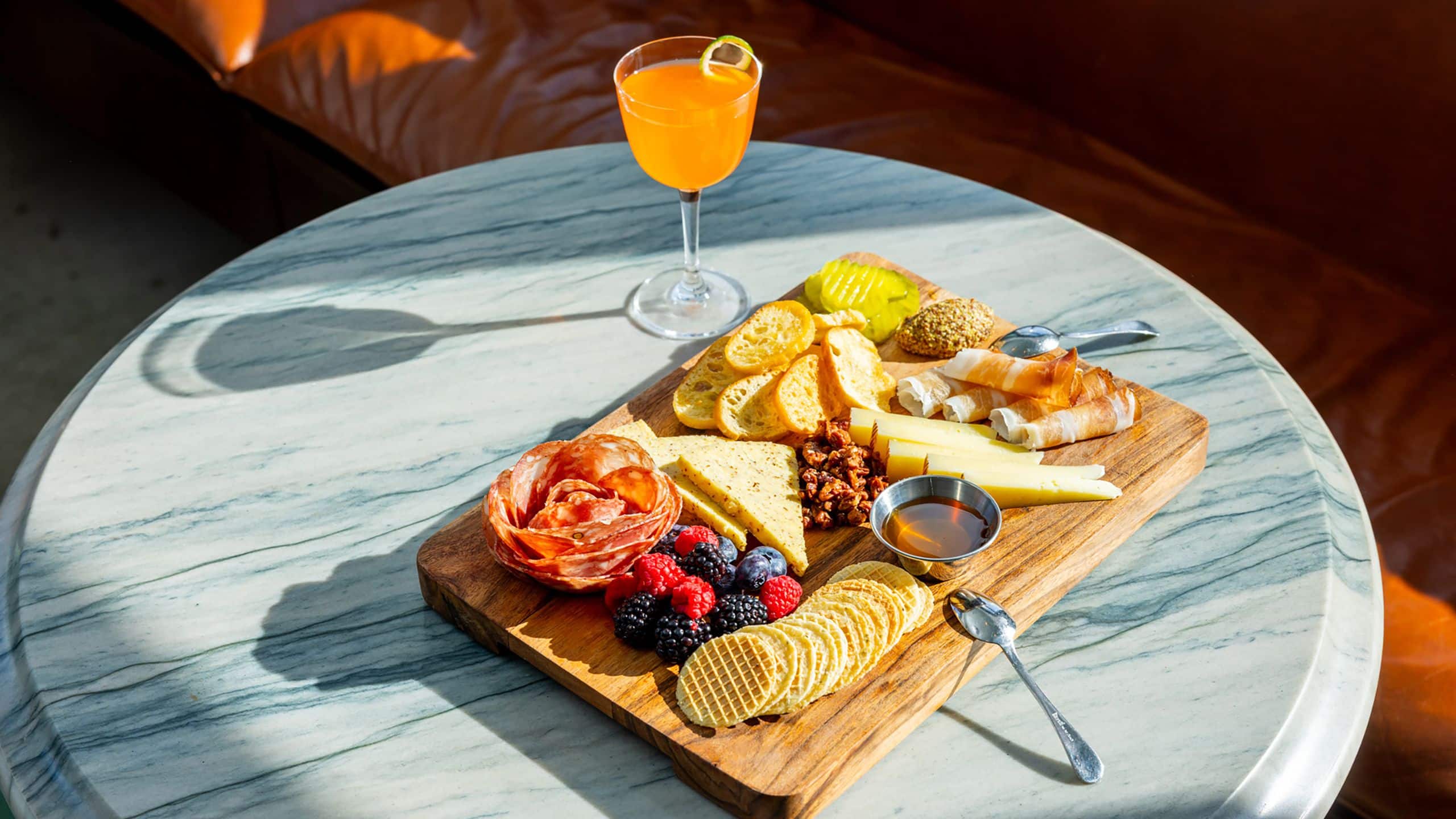 Hotel Genevieve, Bunkhouse Hotels Bar Genevieve Charcuterie Board Sunset
