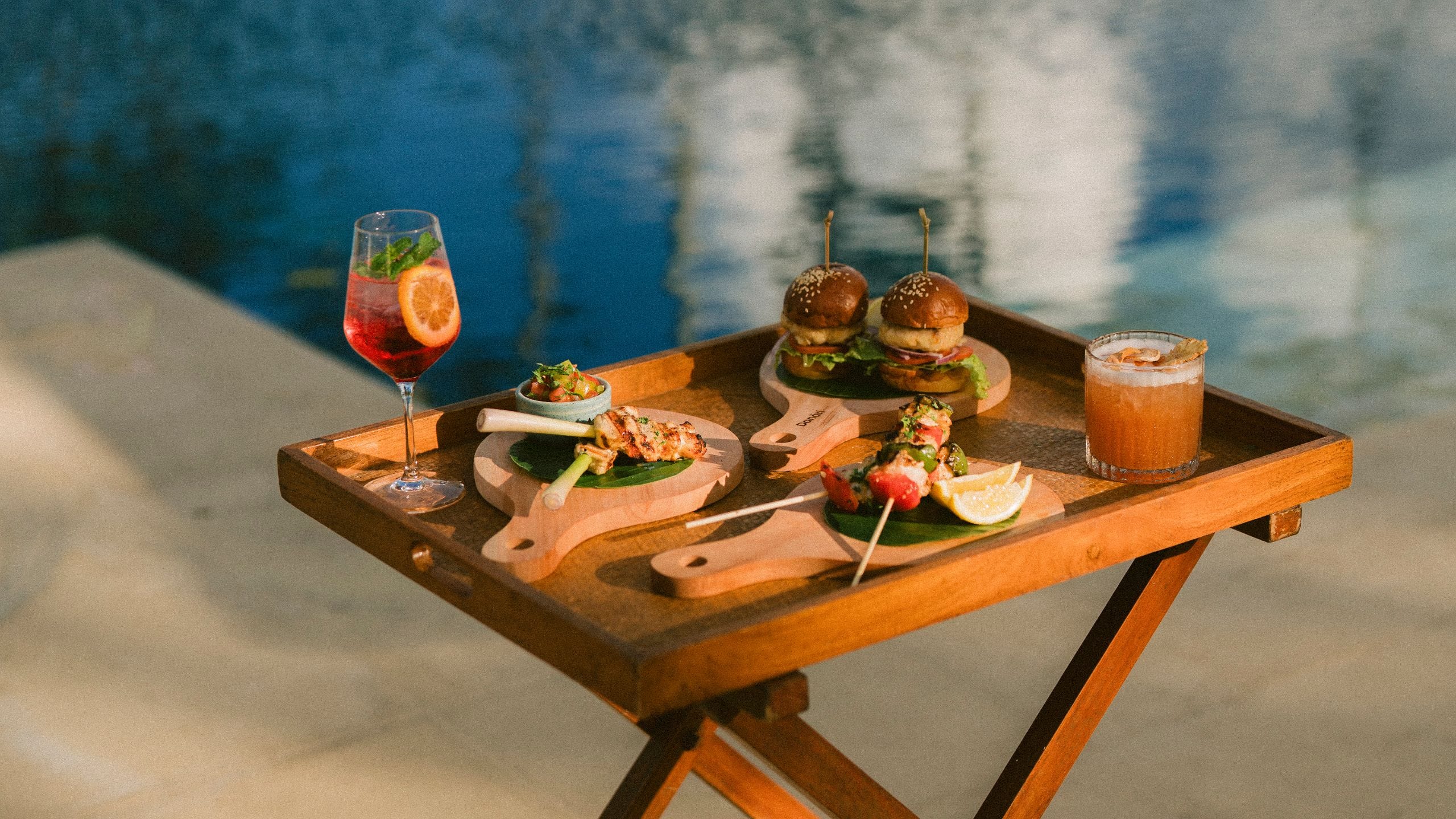 Alila Manggis Dining Setup By The Pool