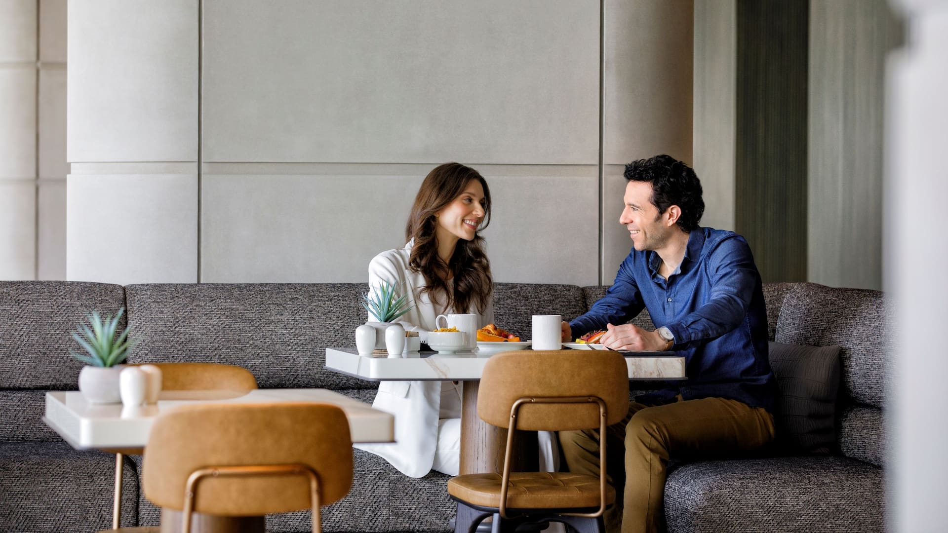 Hyatt Regency Jersey City on the Hudson Couple Eating Breakfast In Exchange Dining Area