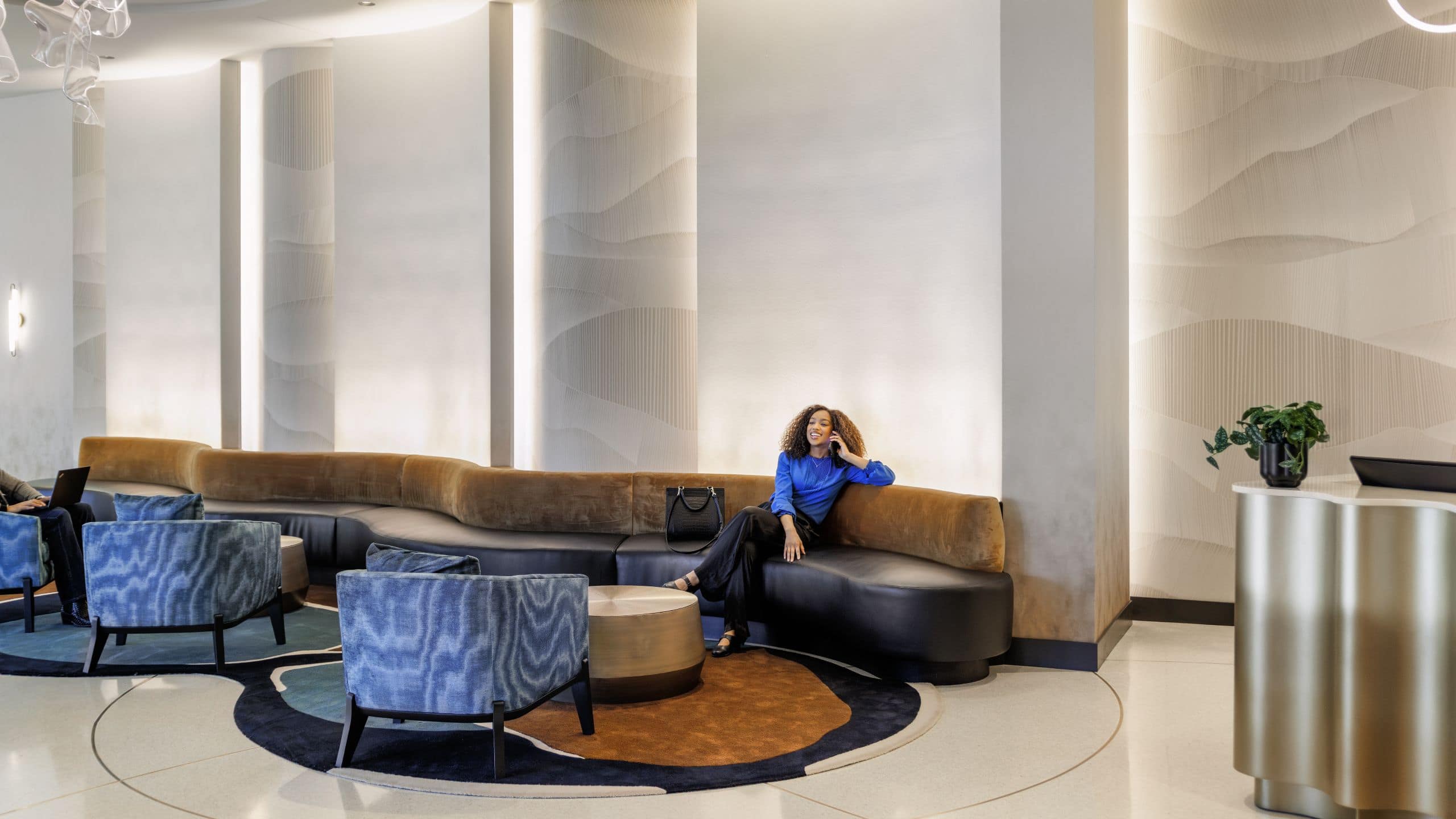 Hyatt Centric Chicago O’Hare Woman Lounging In Lobby