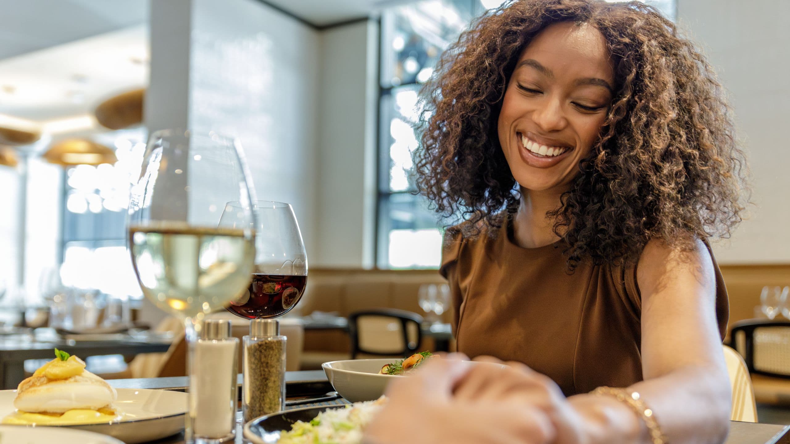 Hyatt Centric Chicago O’Hare Woman Dining