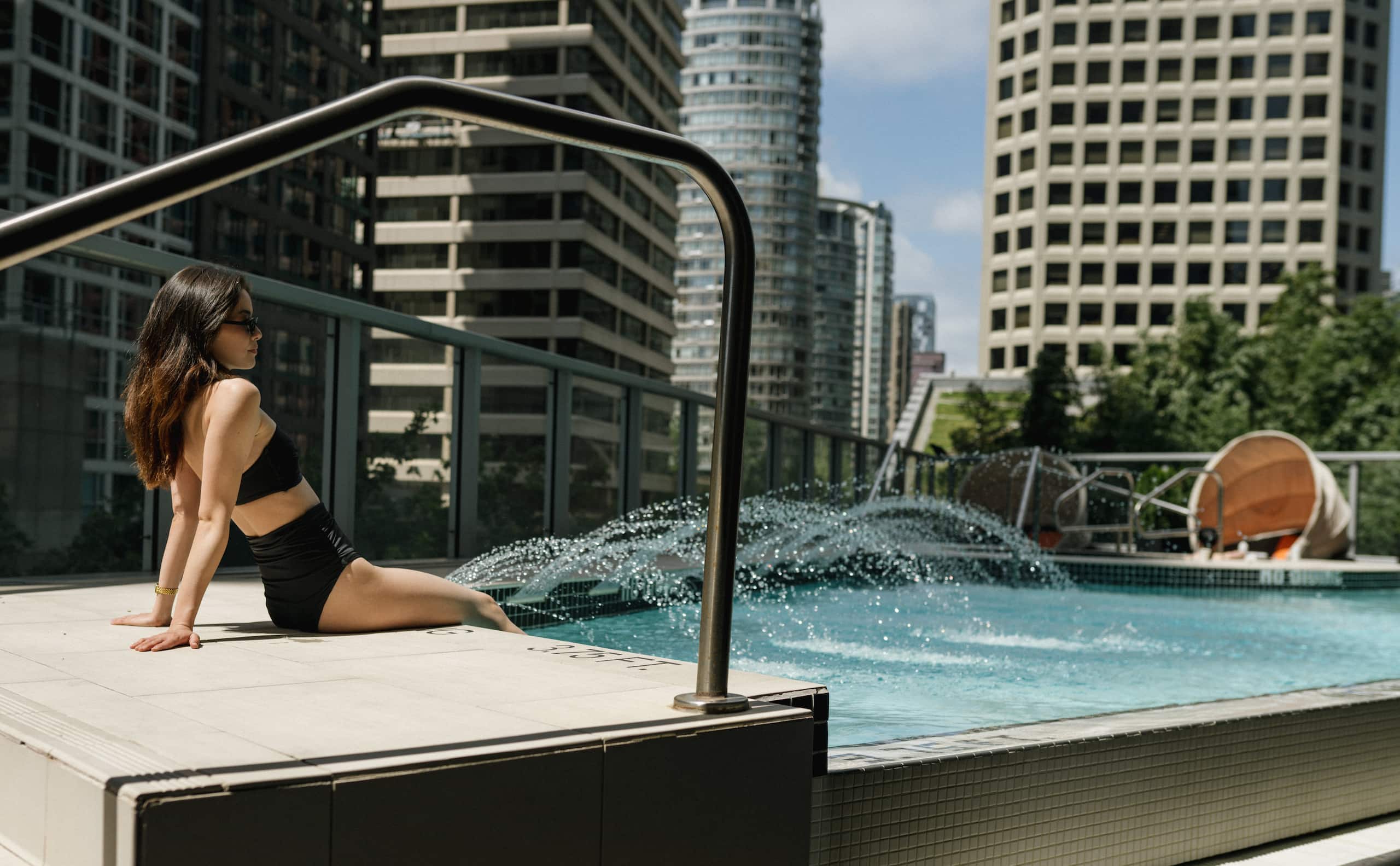 Hyatt Vancouver Downtown Alberni Guest Relaxing By Pool