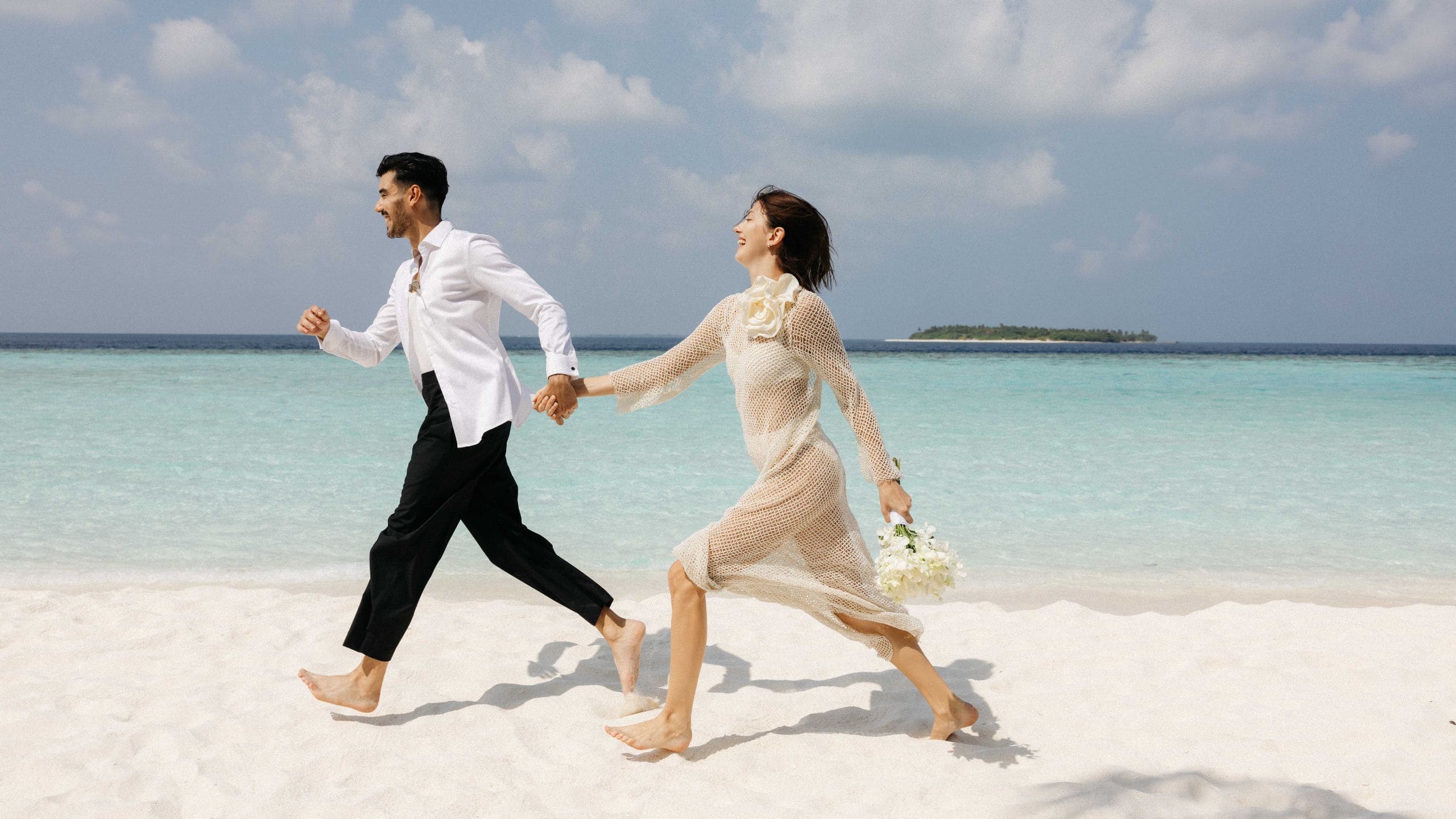 The Standard, Maldives Lifestyle Wedding Couple Running On The Beach