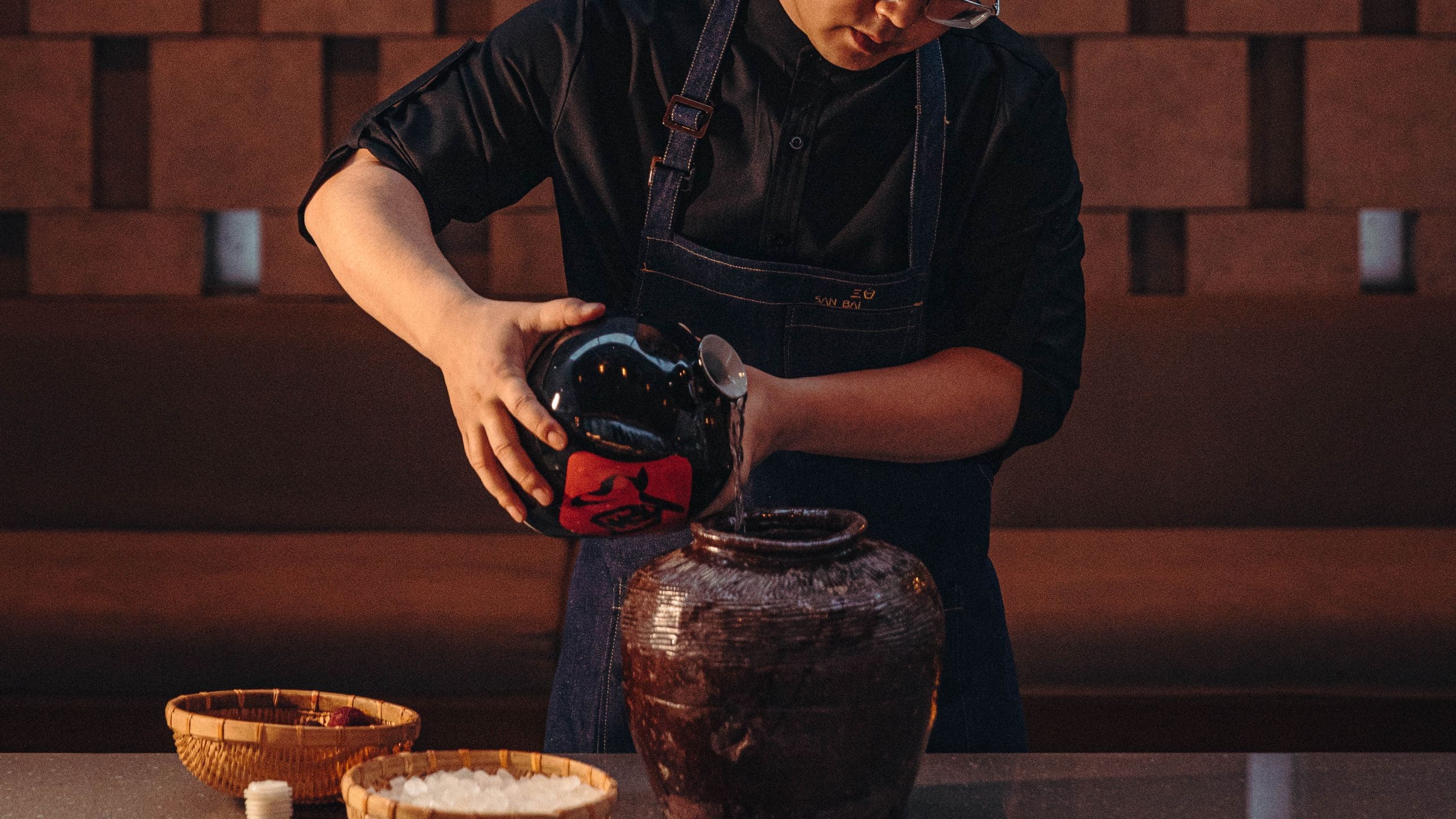 Alila Man Pouring into Jars
