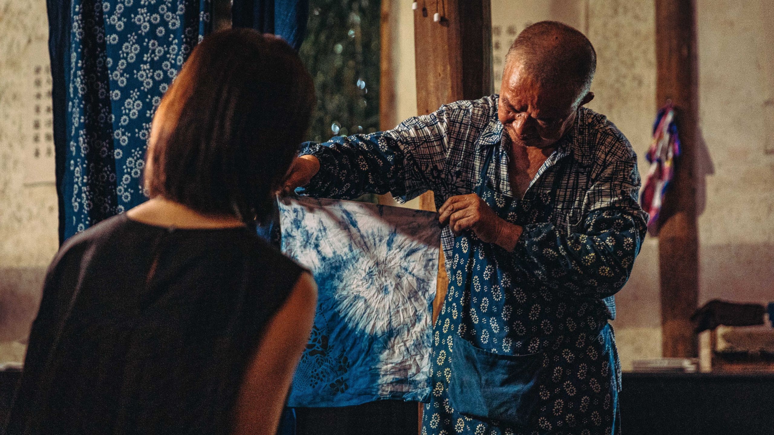 Alila Man Showing Indigo Dyed Fabric