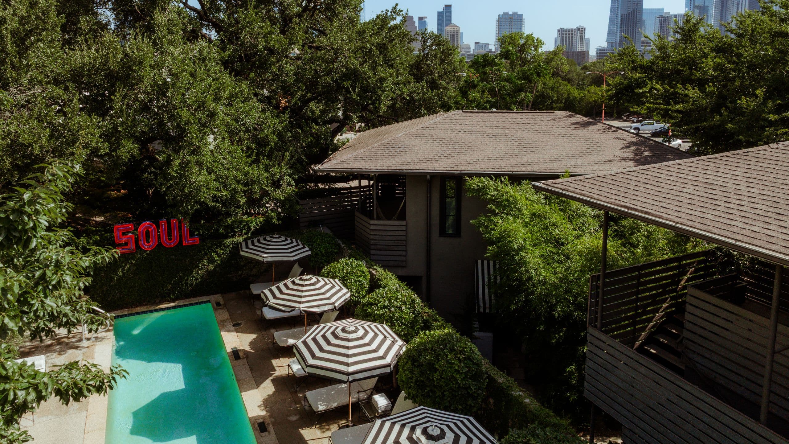 Hotel Saint Cecilia, Bunkhouse Hotels Pool Drone Angled Skyline
