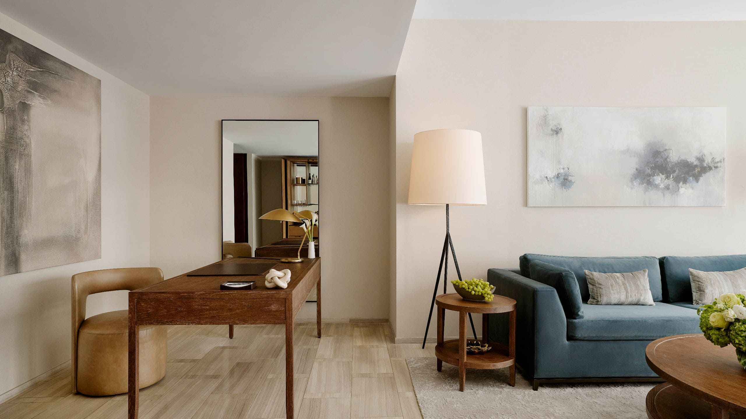 A freestanding bathtub in a room with modern wood paneling