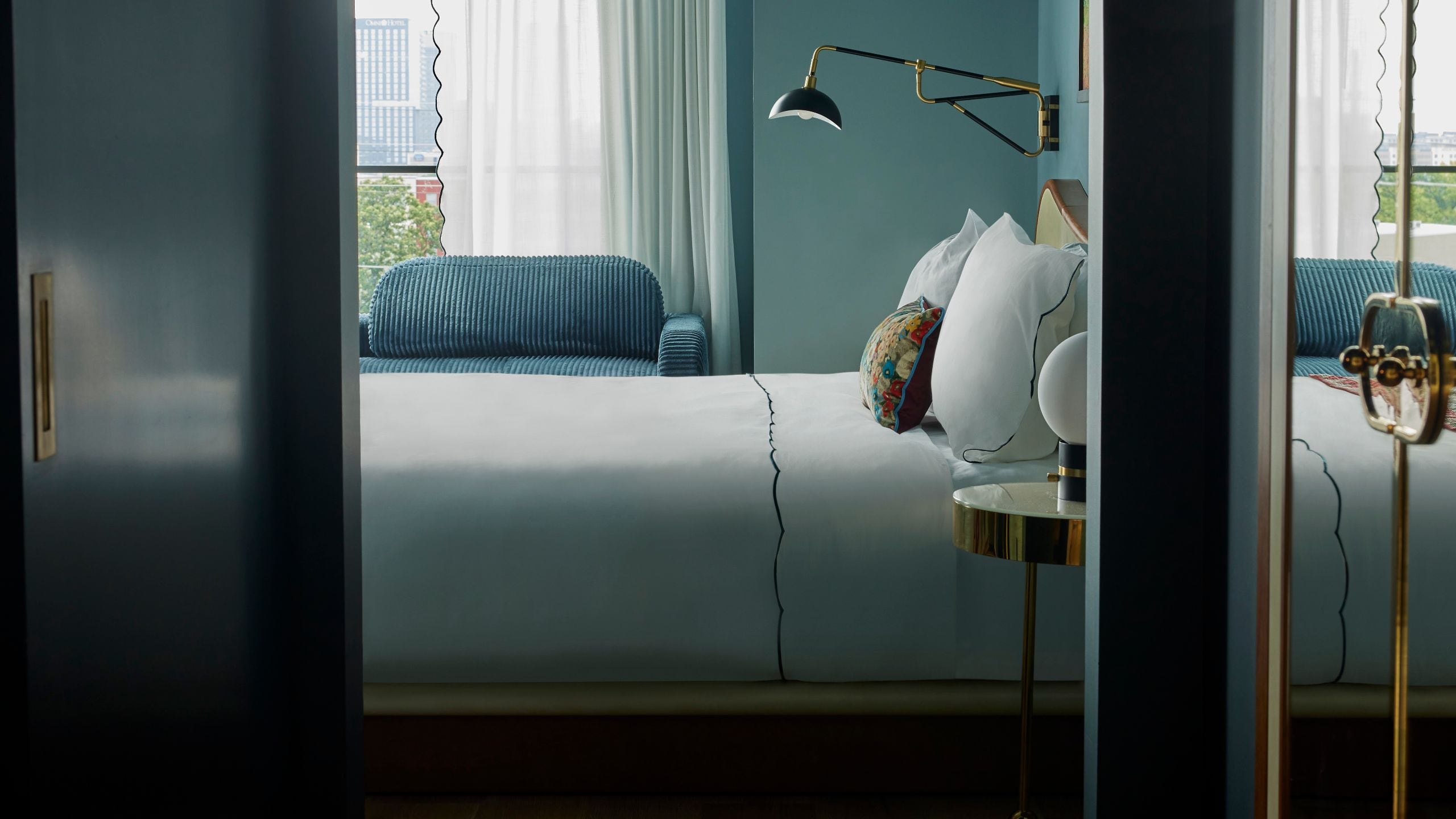 2 of 4 Hotel Genevieve Deluxe King Guestroom Arched Entry