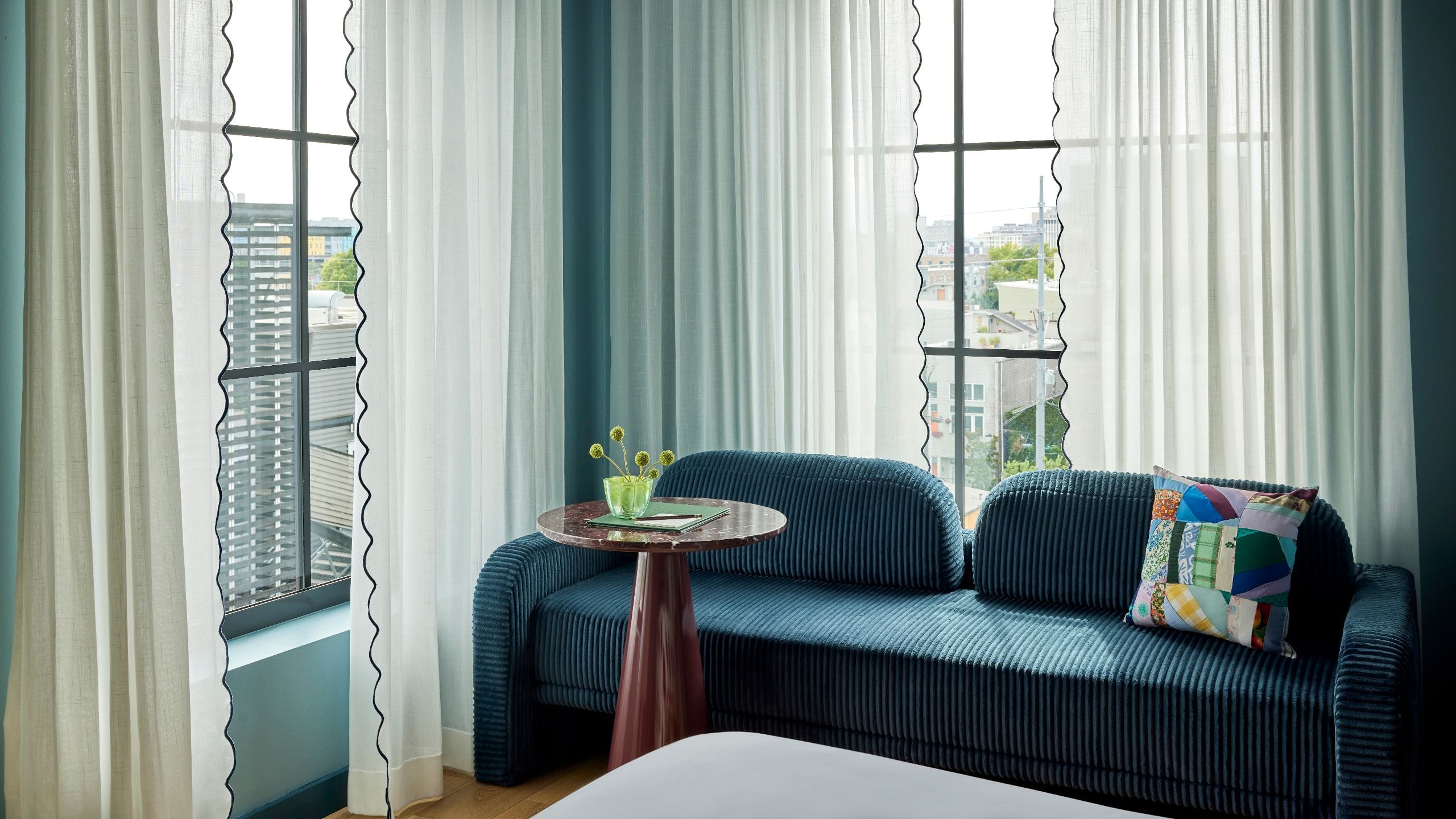 3 of 4 Hotel Genevieve Deluxe King Bedroom Seating Area