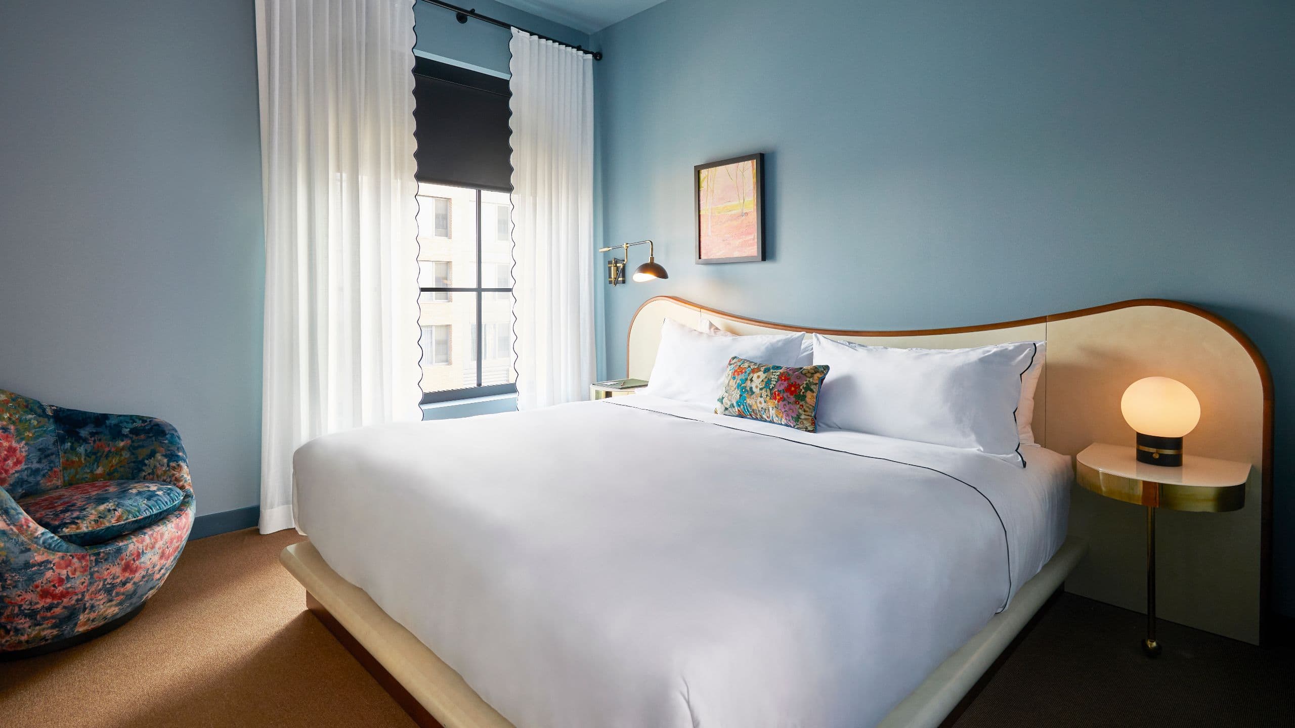 Hotel Genevieve Petite King Guestroom With Upholstered Chair