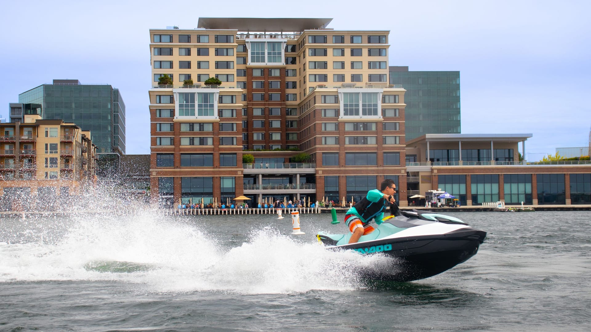 Hyatt Regency Lake Washington at Seattle's Southport Jetski Speeding by Hotel