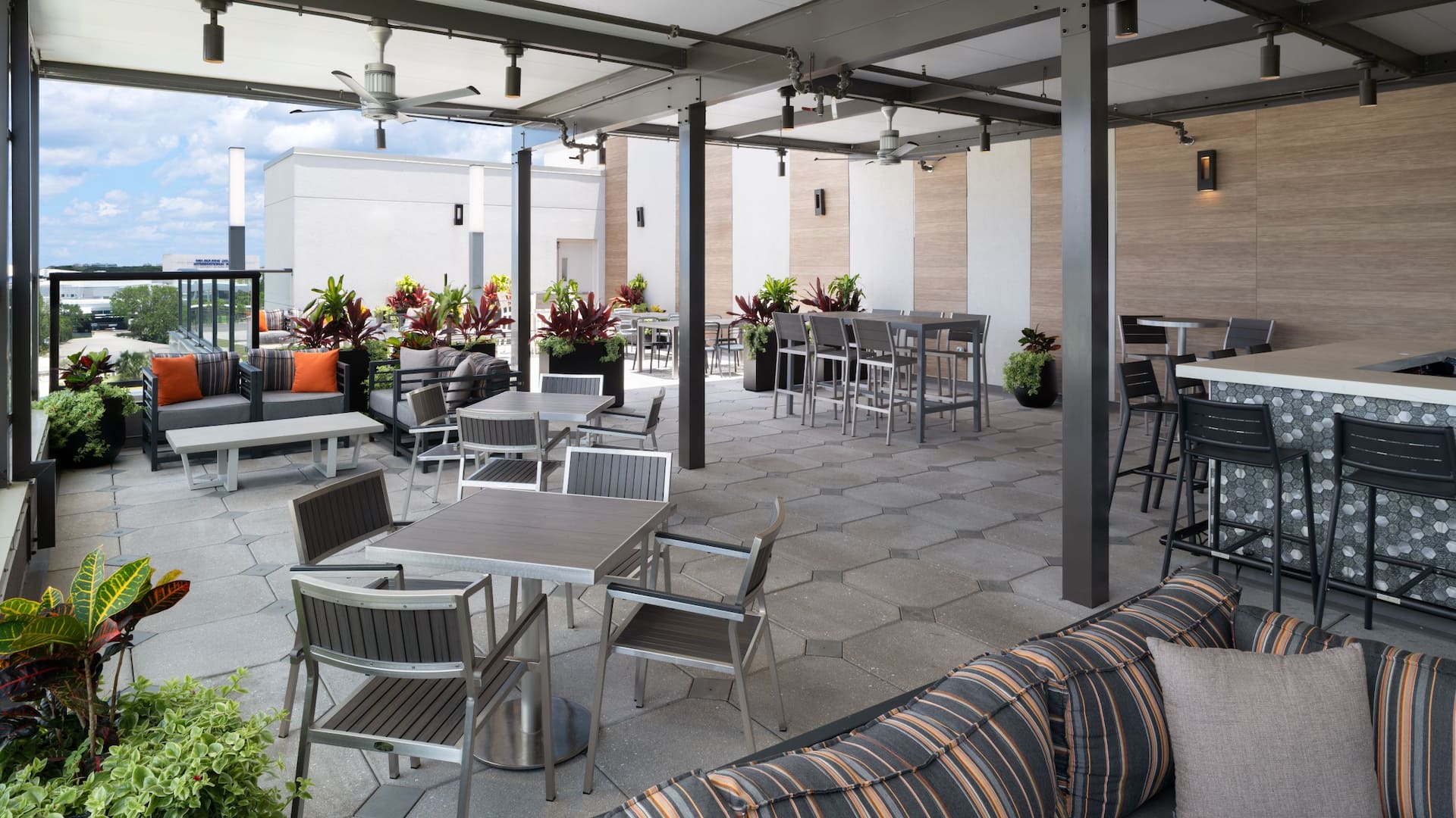1 of 8 Hyatt Place Melbourne Airport Runway Rooftop Lounge Seating
