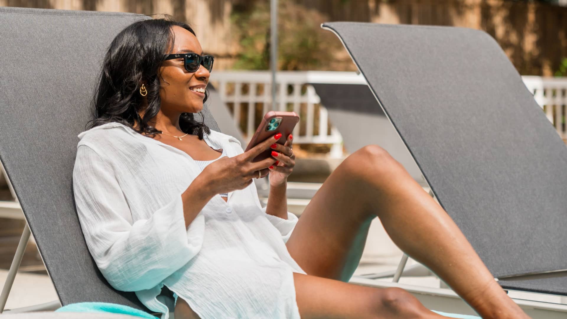1 of 2 Grand Hyatt Atlanta in Buckhead Woman Relaxing By Pool
