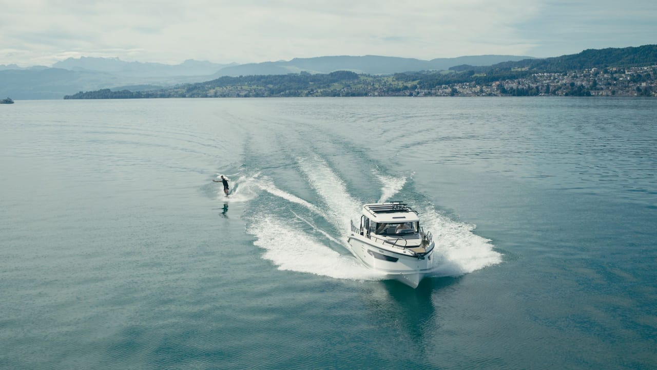 Person on Water Skis behind a boat on Lake Zurich