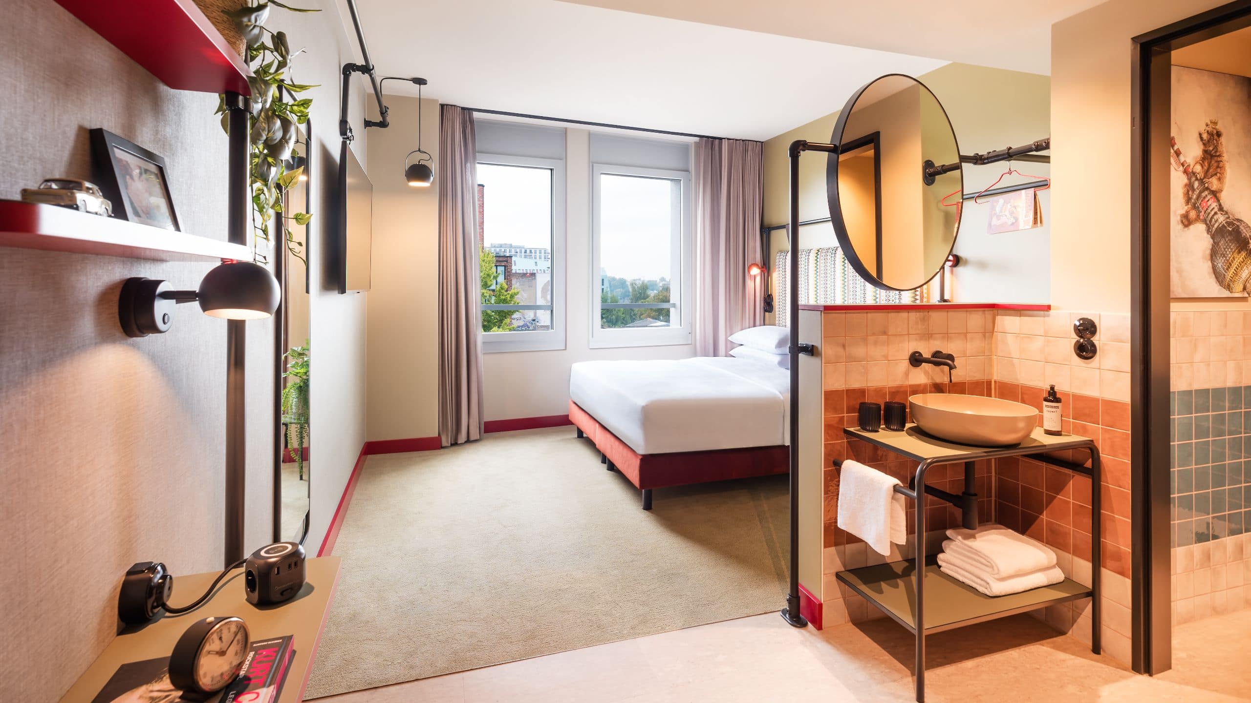 2 of 6 Me and All Hotel Berlin East Side Guestroom King Bed View Premium Entrance Bathroom Open