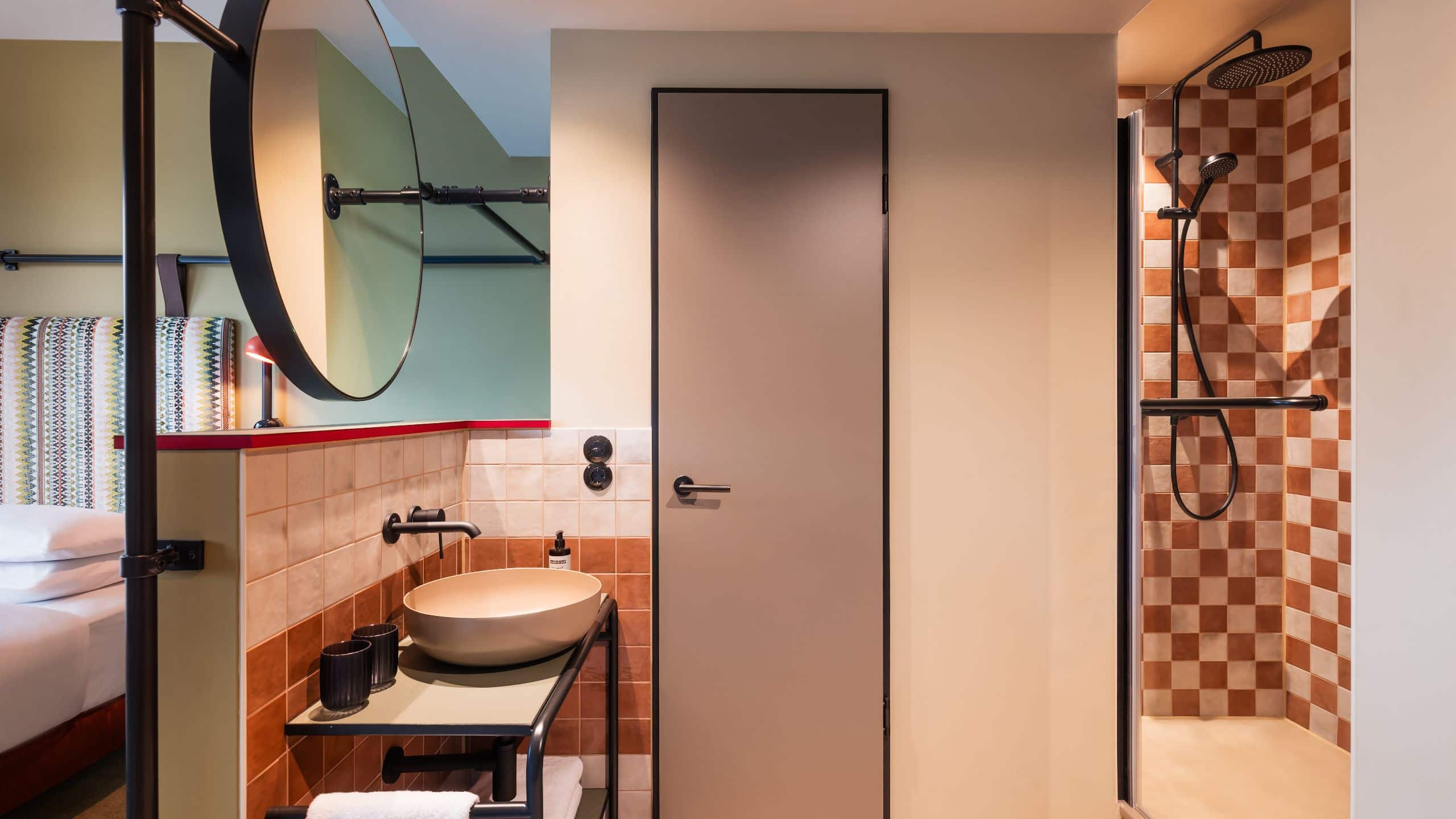 2 of 5 Me and All Hotel Berlin East Side Guestroom King Bed View Premium Bathroom Overview