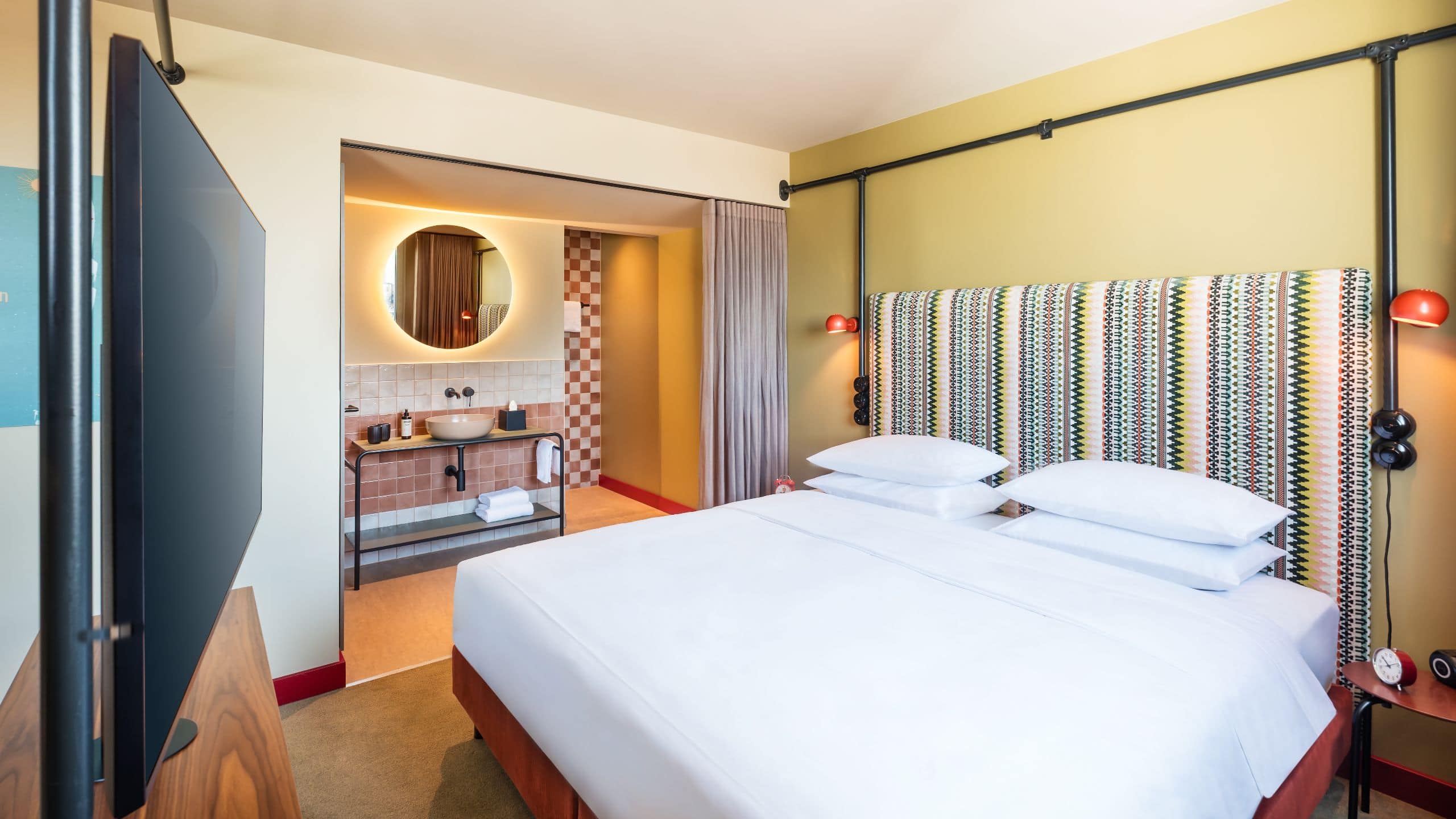 3 of 7 Me and All Hotel Berlin East Side Guestroom King View Premium Bed And Bathroom