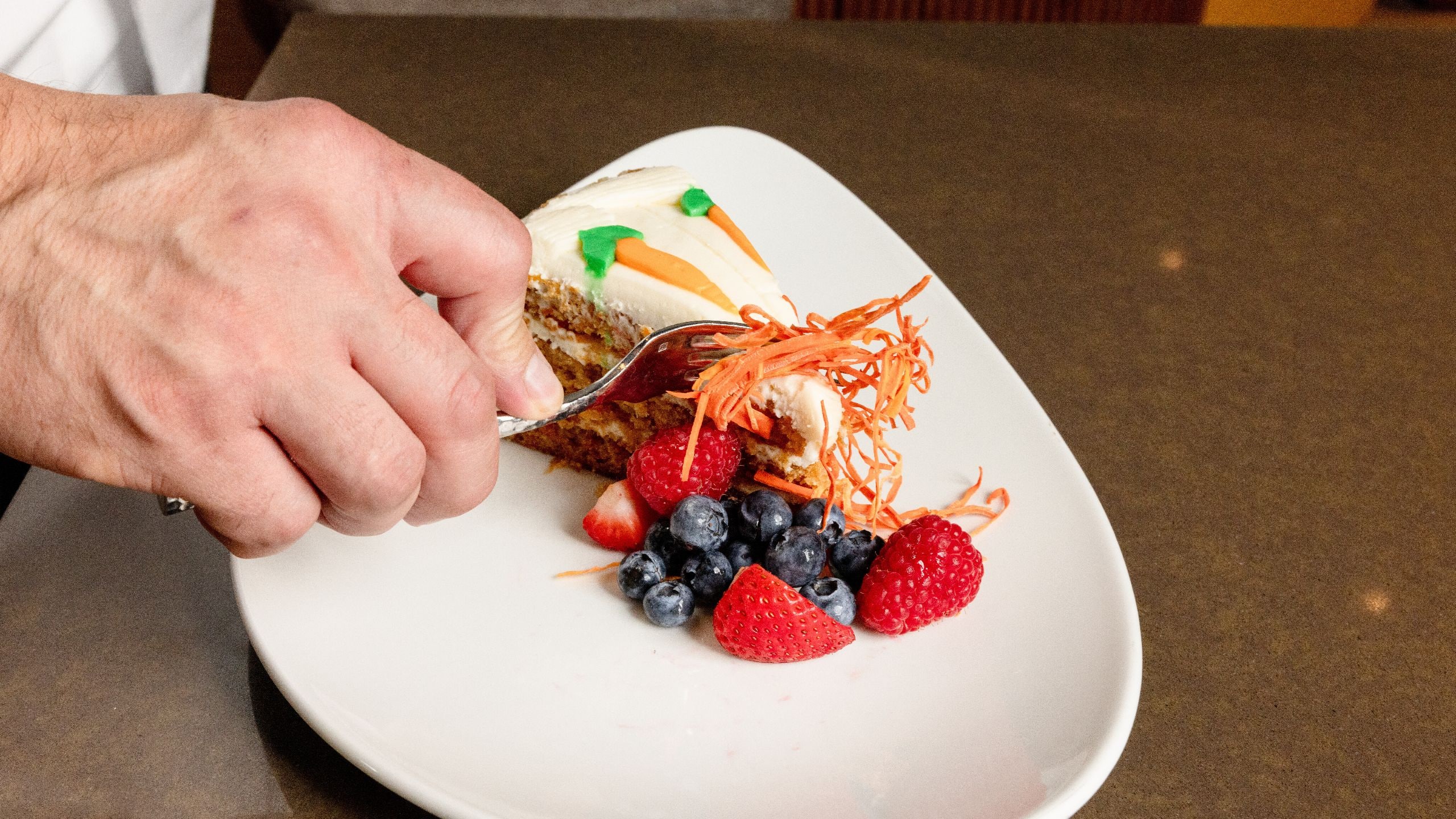 Hyatt Centric Chicago Magnificent Mile The Bridge Kitchen Guest Cutting Carrot Cake