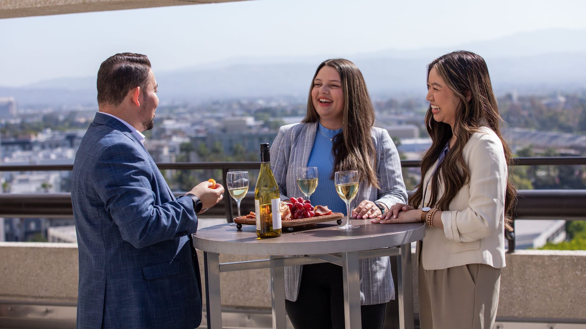 1 of 1 Hyatt Regency Irvine Guests Dining On Rooftop With Skyline Views