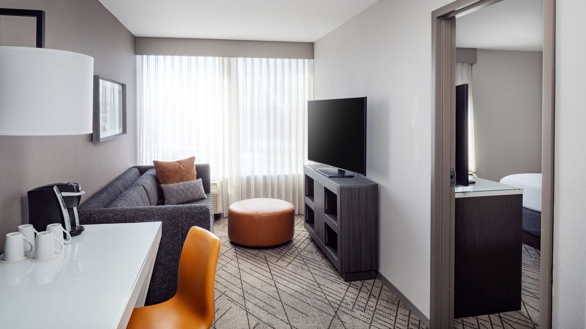 Hyatt House Washington DC / Downtown / Convention Center Living Area Couch Tv Desk