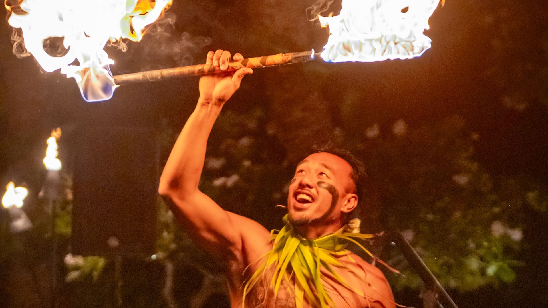 1 of 1 Grand Hyatt Kauai Resort & Spa Luau Fire Dancer Arm Raised