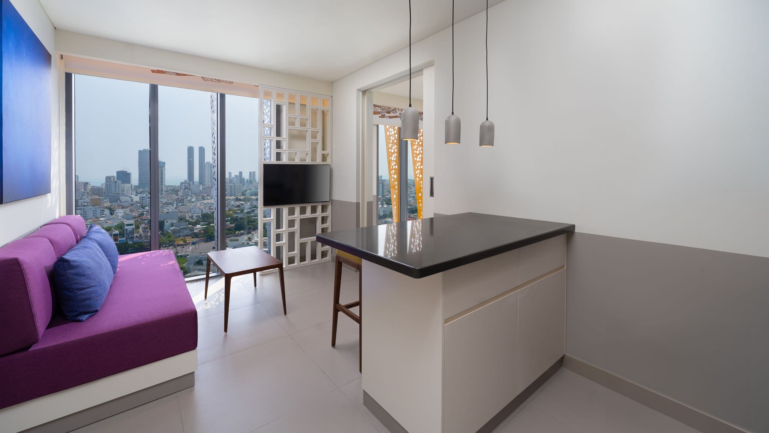 3 of 4 Wink Hotel Danang Riverside One King Bed Suite City View Living Room