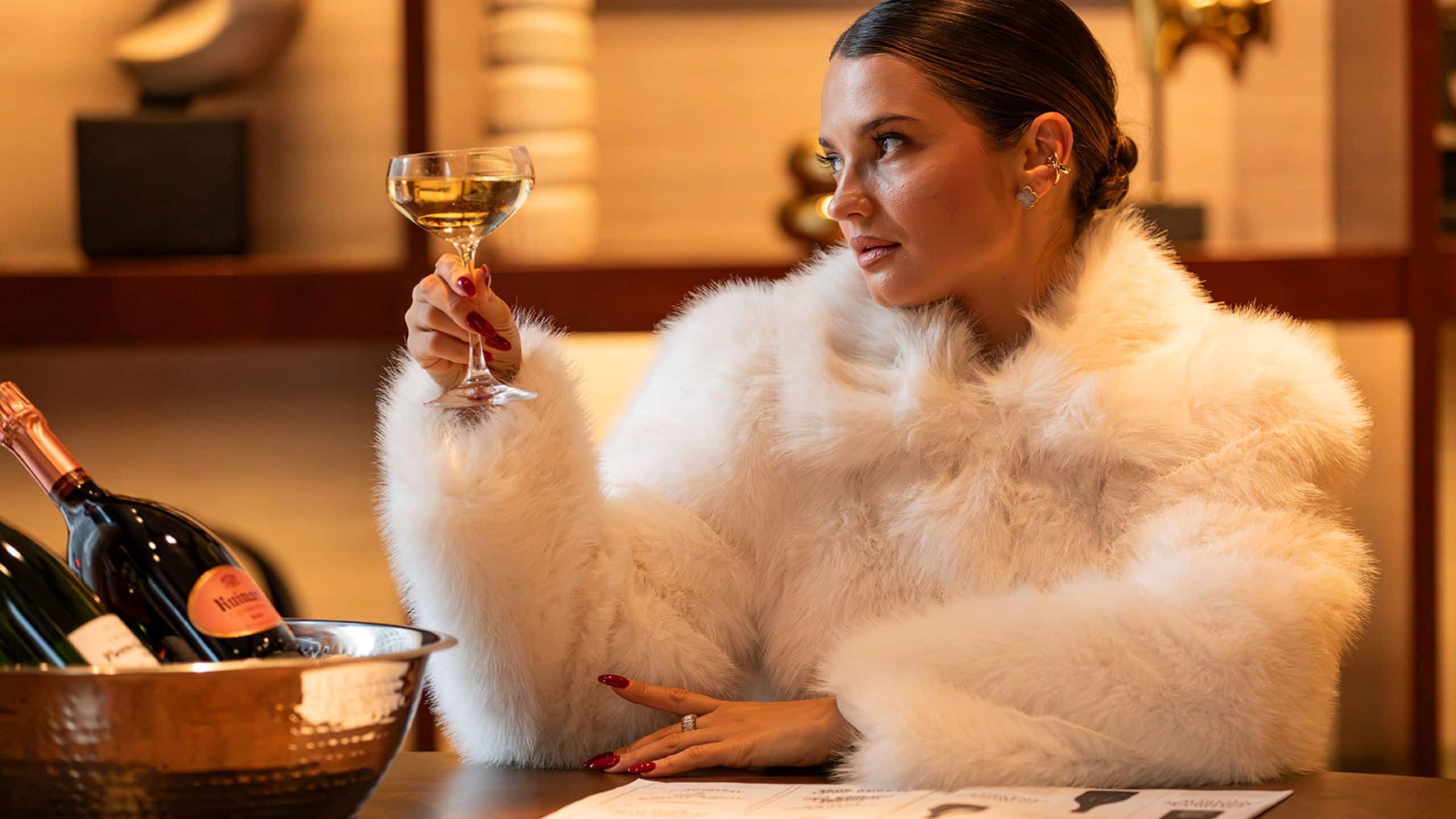 Park Hyatt Chicago Champagne Row Woman Drinking Glass Jacket