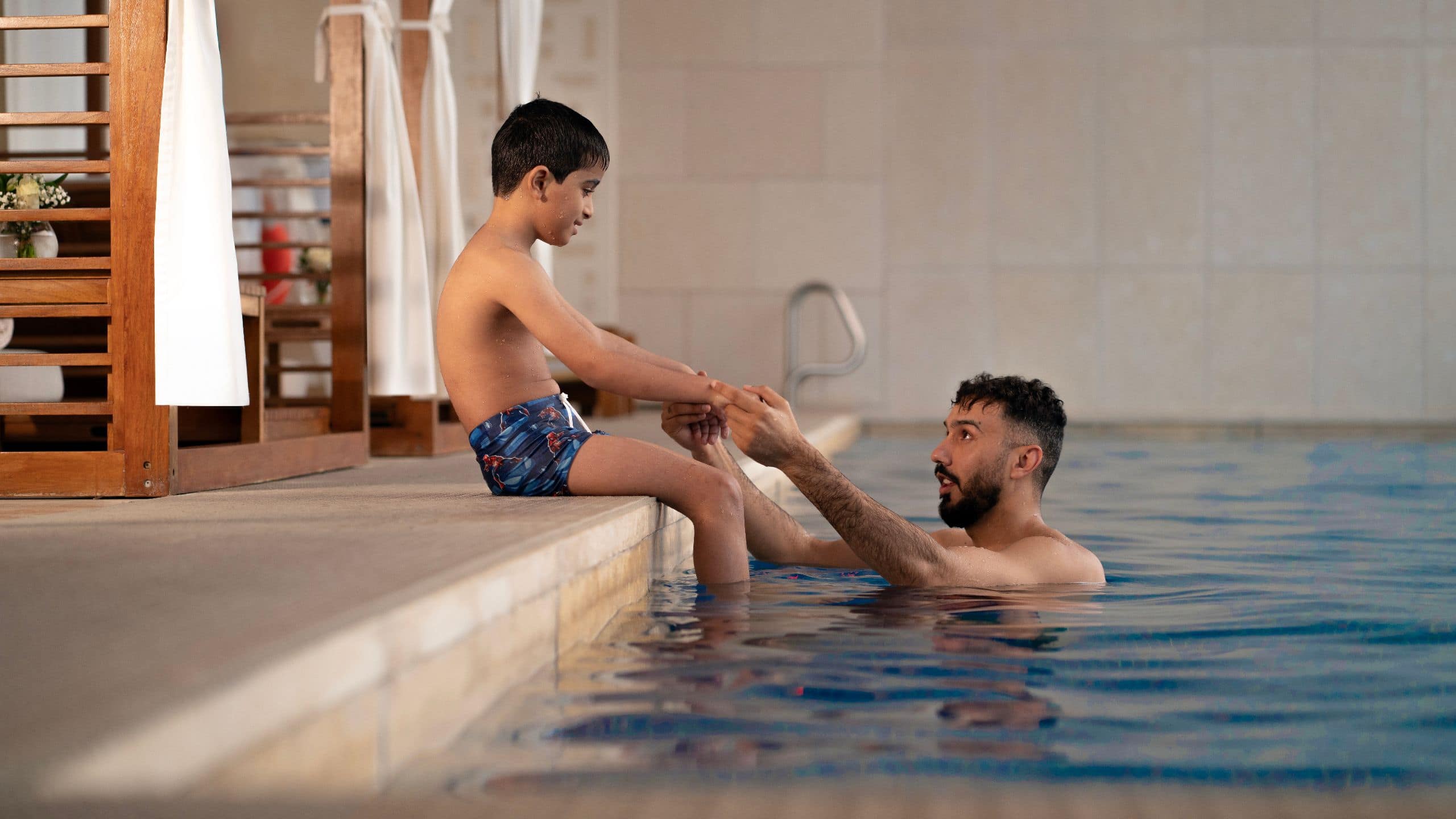 Park Hyatt Doha Pool Father Son Playing
