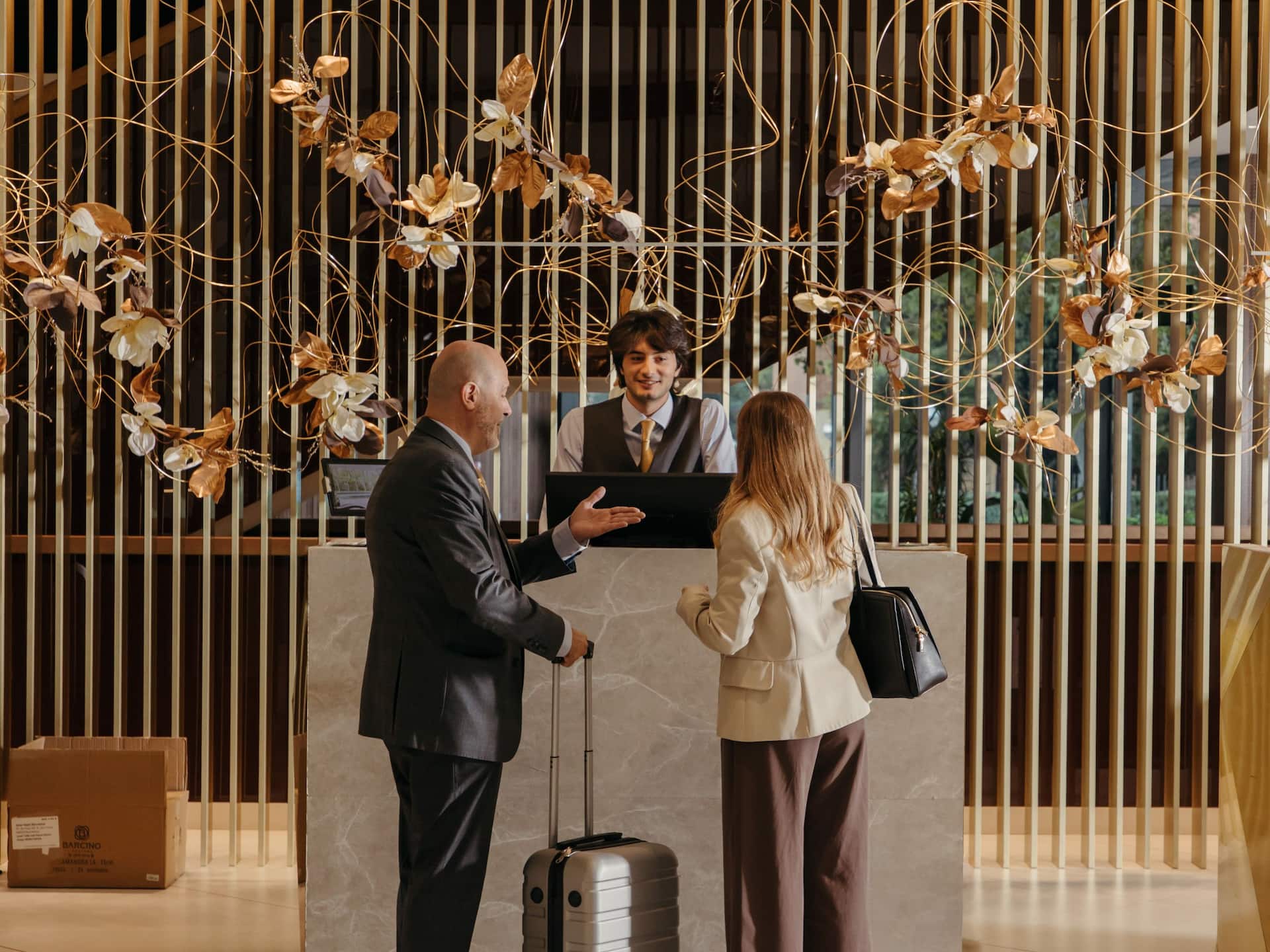 Grand Hyatt Barcelona Guest Checking In Reception Interacting With Employees