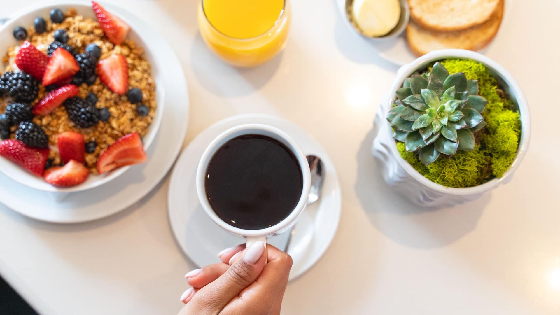 5 of 6 Hyatt Centric Delfina Santa Monica Woman Holding Coffee