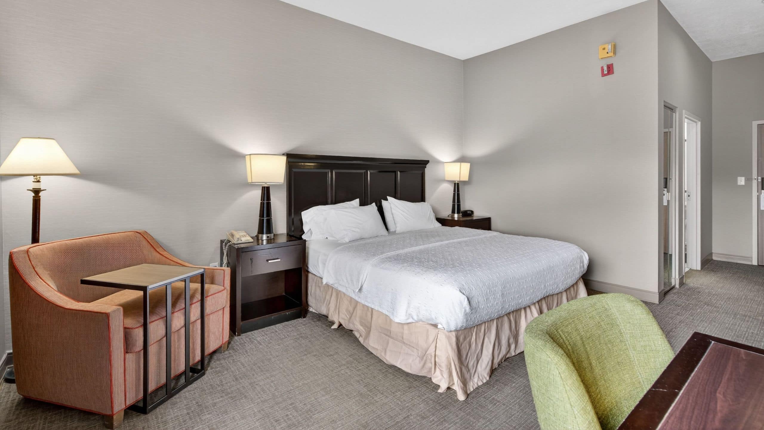 2 of 3 Hotel SLC King Guestroom And Bedside Chair