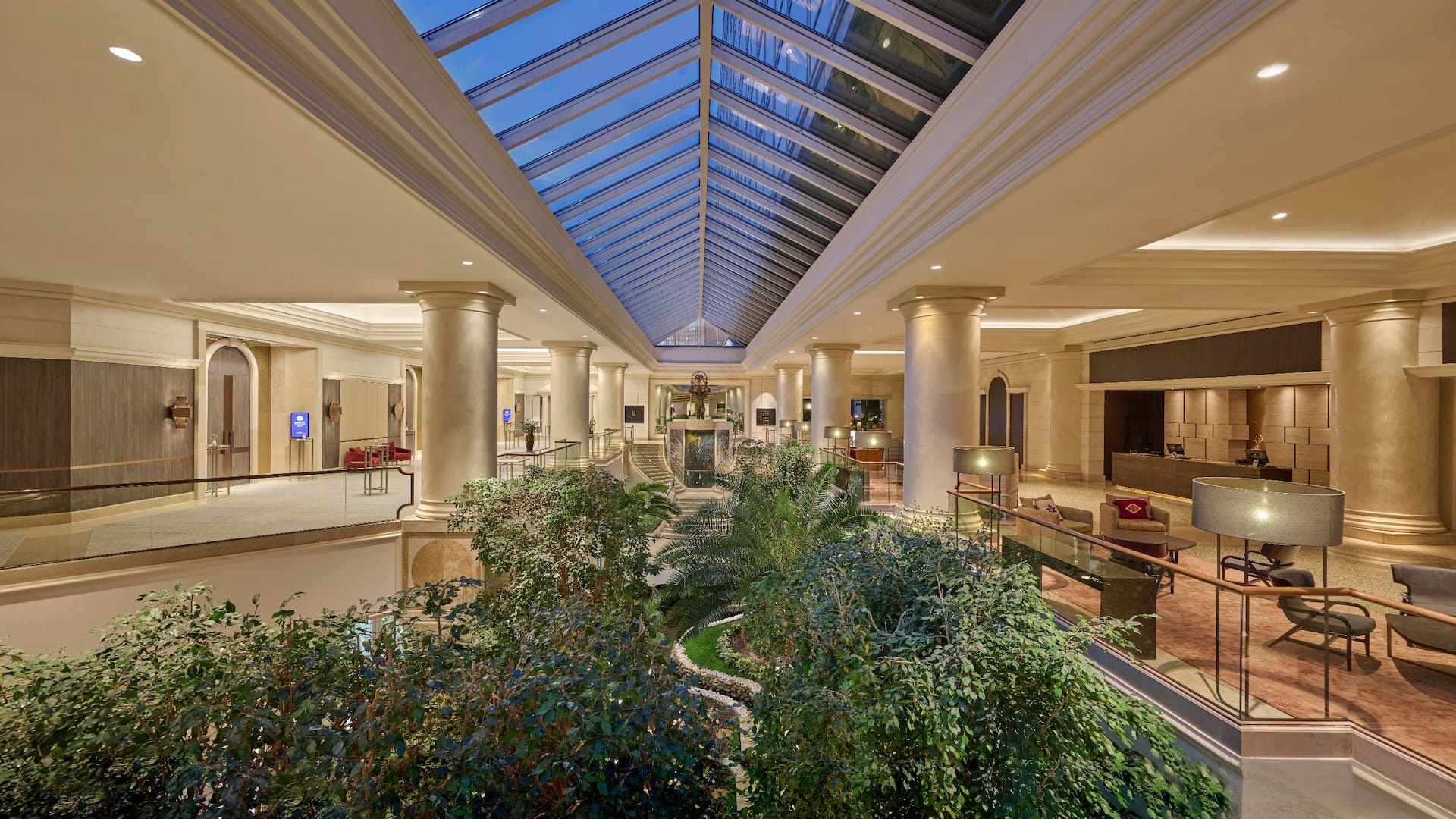 King Bed Room at Hyatt Regency Belgrade with modern furnishings, large windows, and city skyline views.