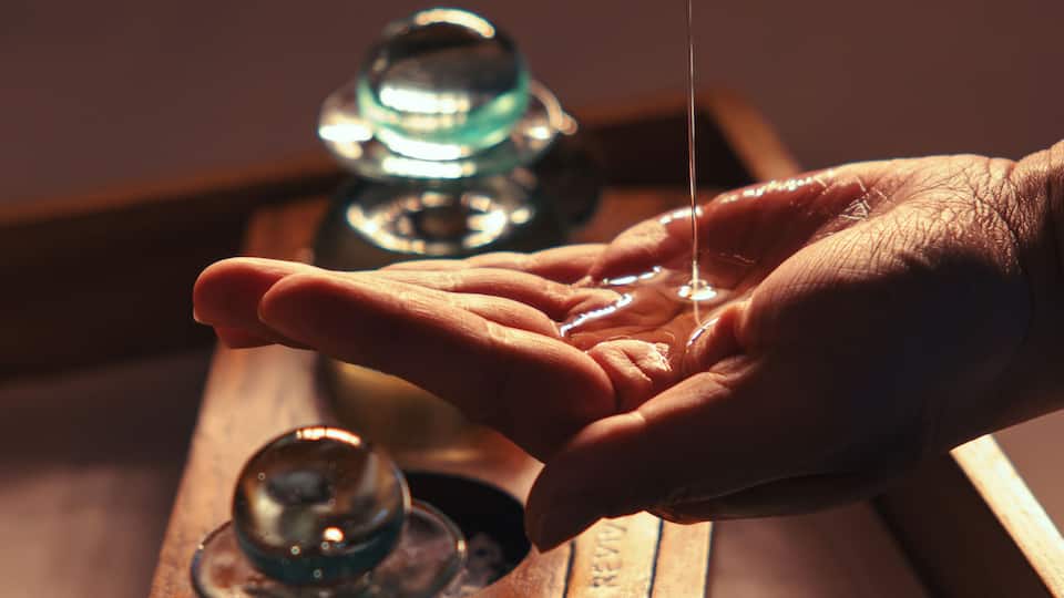 Pouring essential oil